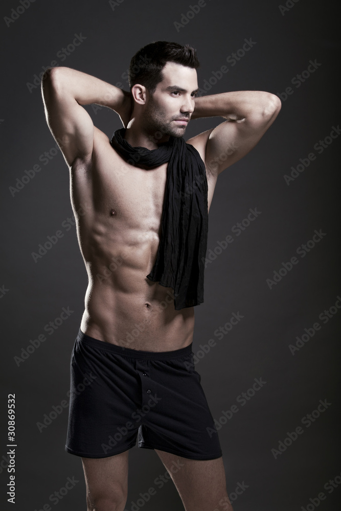 Closeup of a muscular handsome man in underwear
