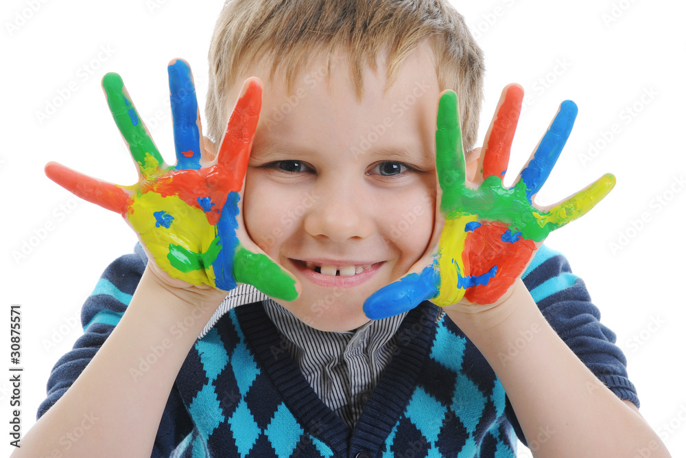 smiling boy with the palms painted by a paint. smiling boy with the palms painted by a paint.