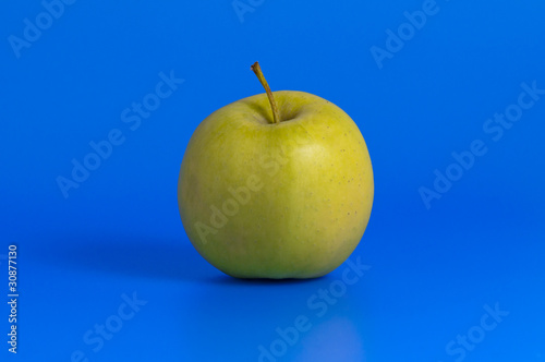 green apple and measurement tape