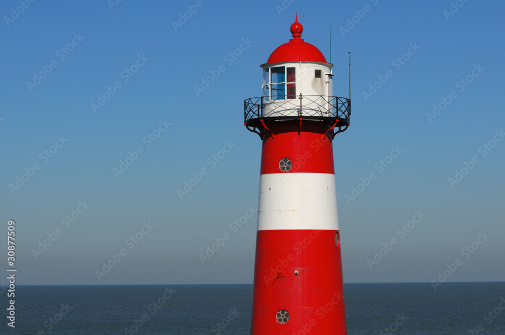 Fototapeta premium Red lighthouse in Zeeland, Netherlands