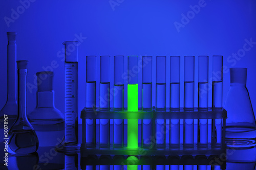 Test tube with fluorescent liquid in support