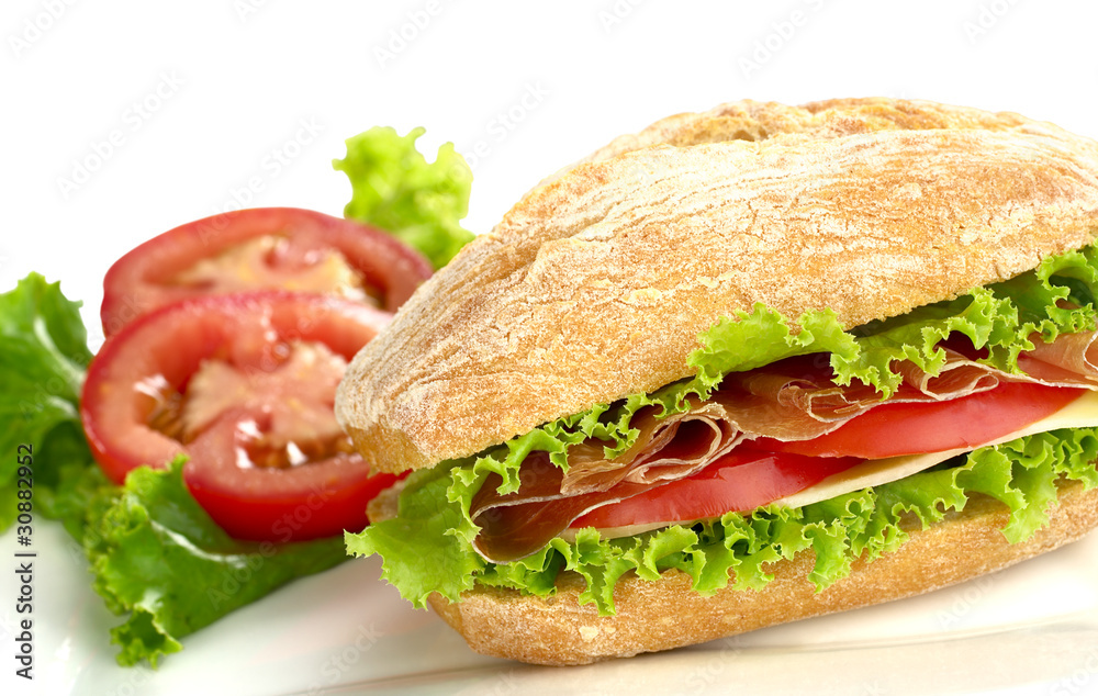 Ciabatta with lettuce, ham, cheese and tomato Ciabatta with lettuce, ham, cheese and tomato