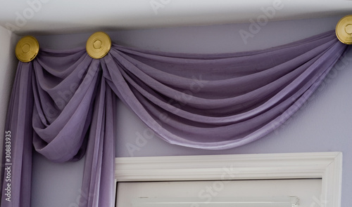 Valance drapery treatment with high ceiling above doorway