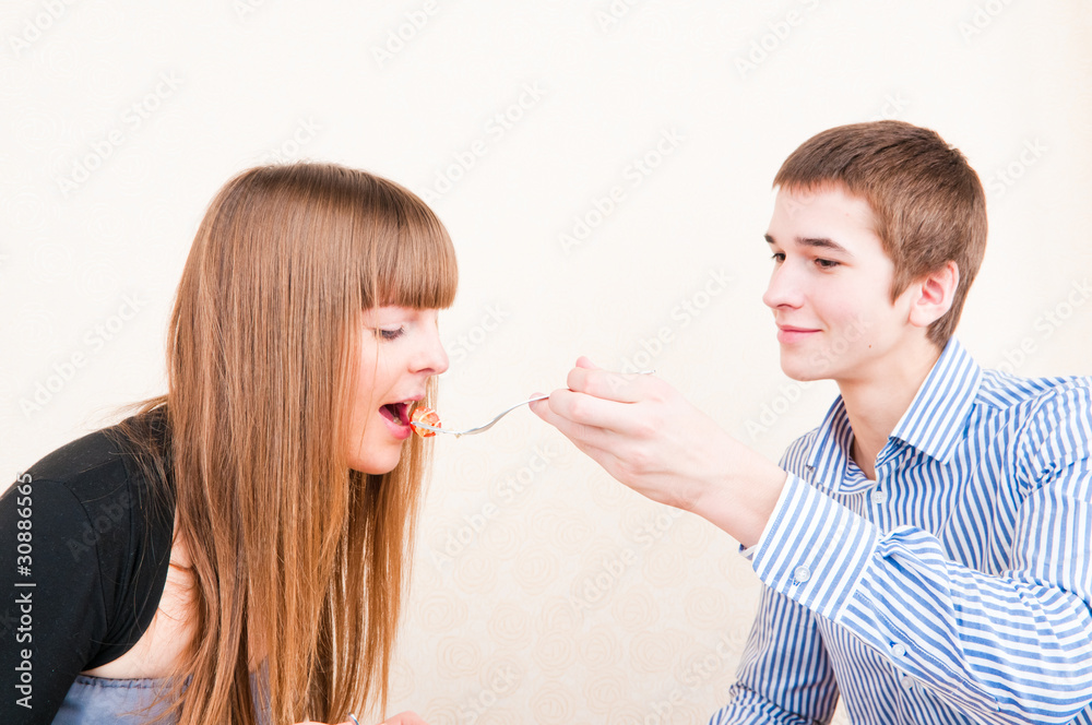 Young Couple Enjoying meal,mealtime Together Young Couple Enjoying meal,mealtime Together