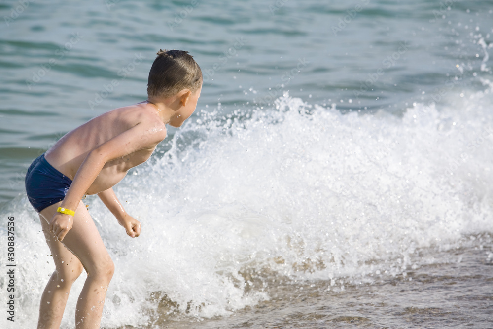 The boy has a fun in water The boy has a fun in water
