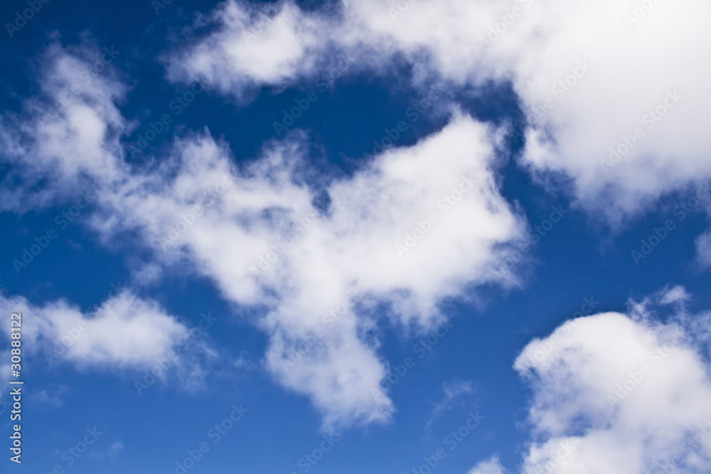 Obraz premium white fluffy clouds in the blue sky