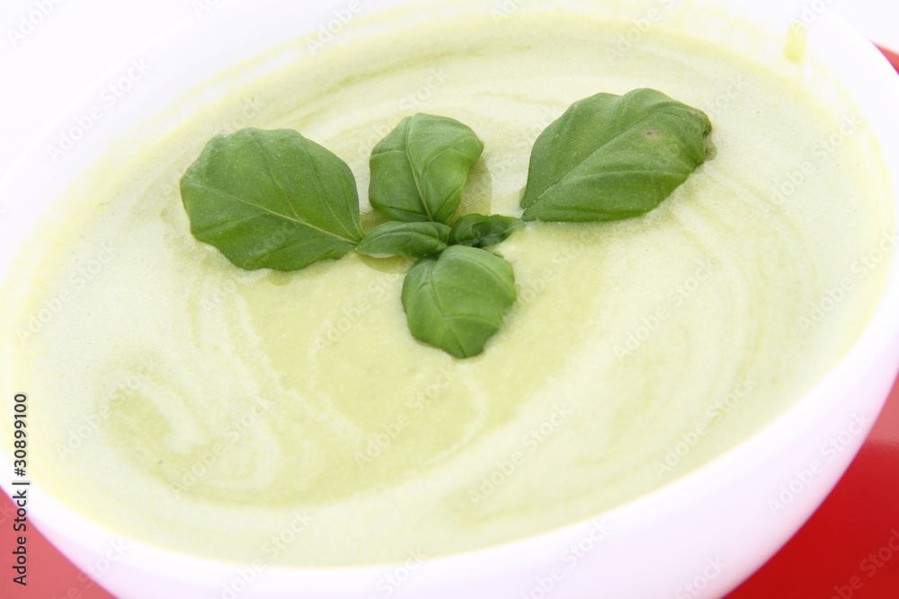 Pea and mozzarella soup decorated with basil Pea and mozzarella soup decorated with basil