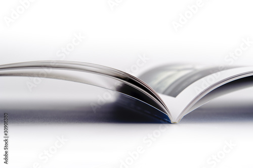 Open photo book on white background