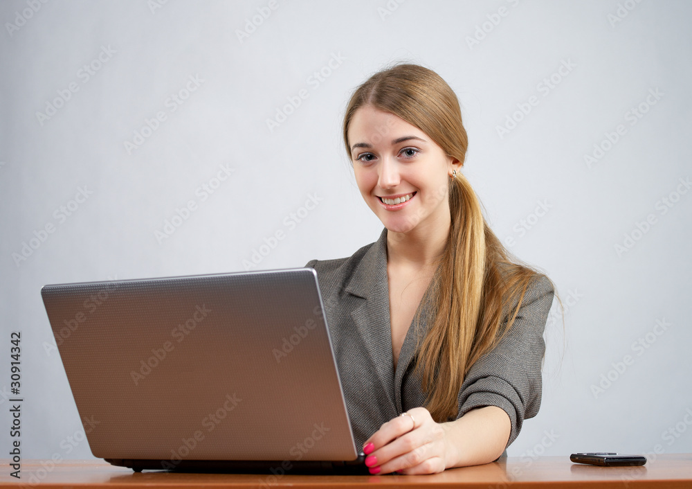 Young female executive working on laptop Young female executive working on laptop