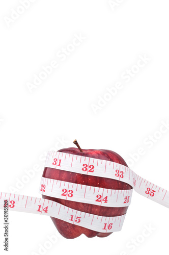 red apple and measure tape