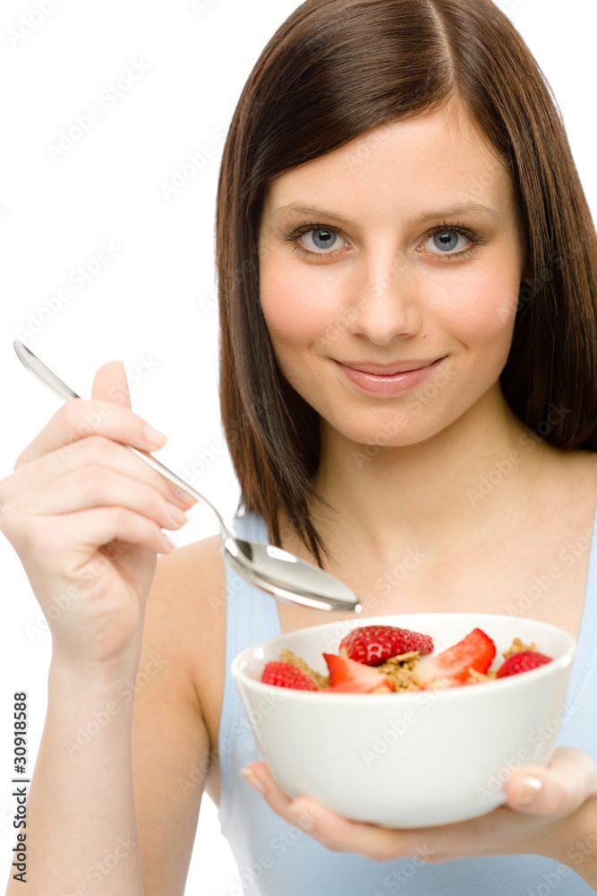 Healthy lifestyle - woman eat strawberry cereal Healthy lifestyle - woman eat strawberry cereal