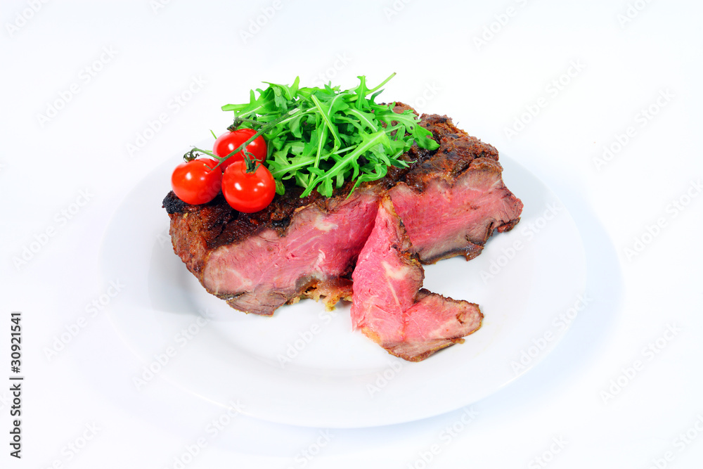Roastbeef with gherkin and hot pepper on white background Roastbeef with gherkin and hot pepper on white background