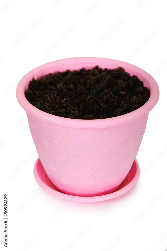 bright pink plastic flowerpot with ground, view from above, isol bright pink plastic flowerpot with ground, view from above, isol