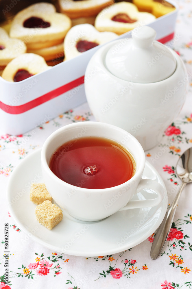 Tea and heart-shaped cookies in a tin box Tea and heart-shaped cookies in a tin box