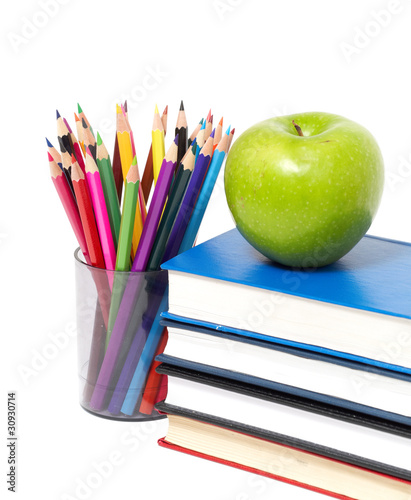 apple, books and colored pencil