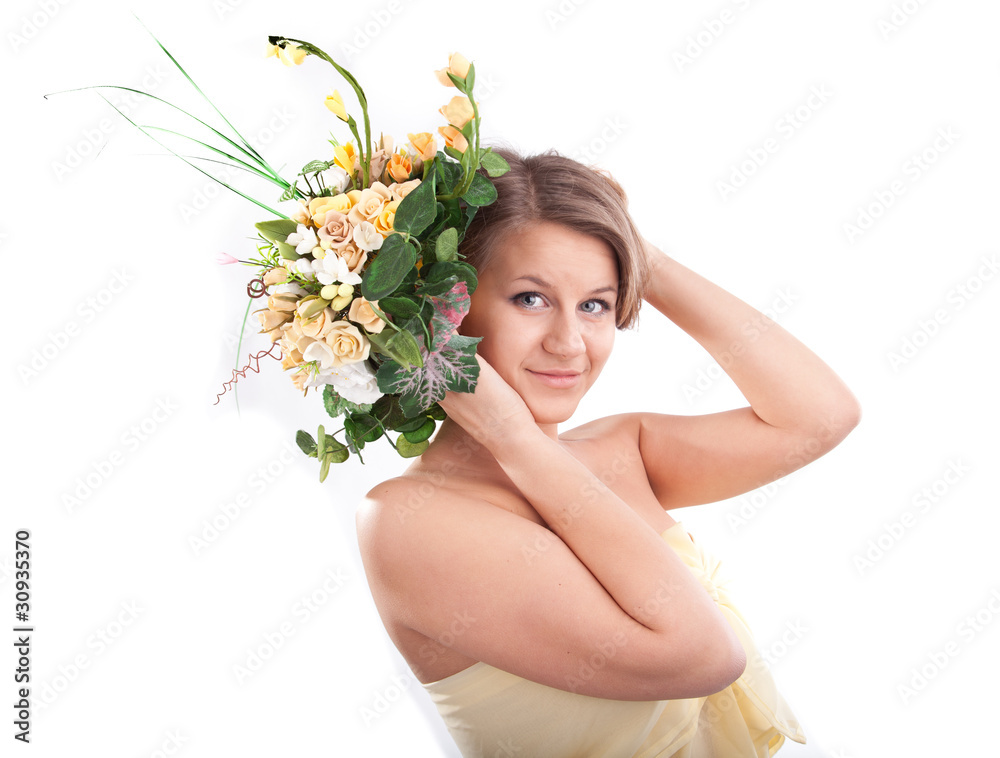Young woman holding flowers near head