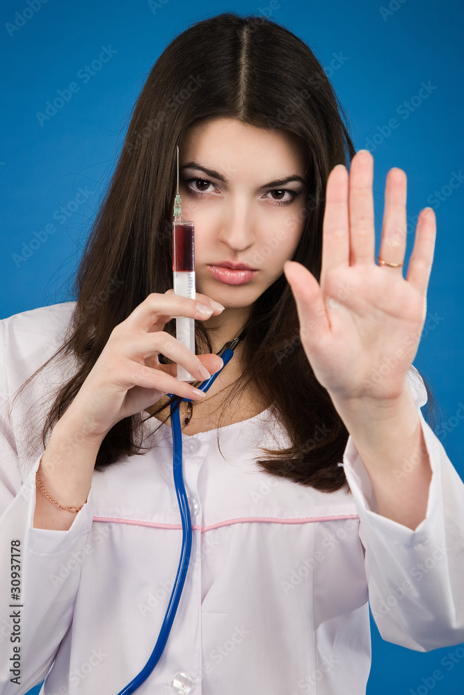 Nurse with a disposable syringe Nurse with a disposable syringe