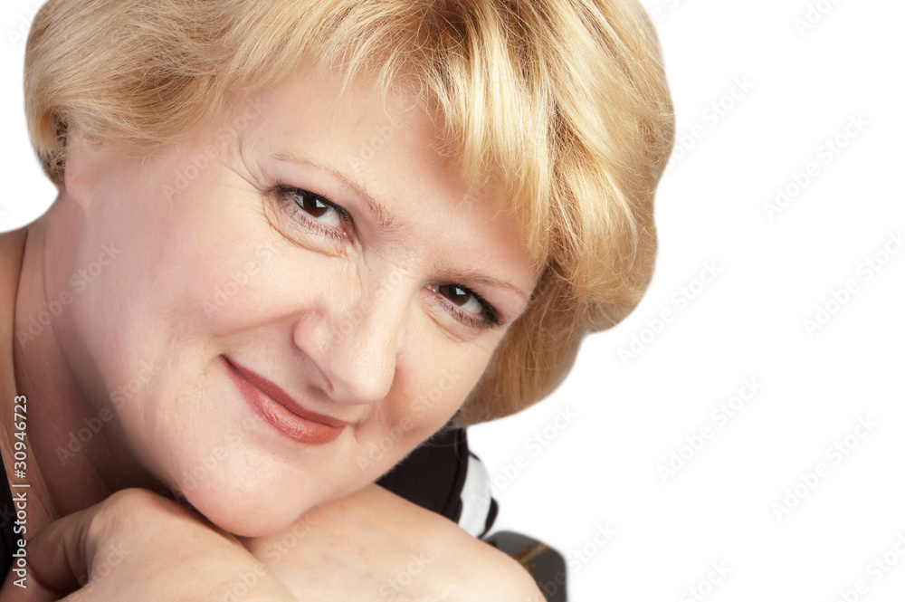 woman at age of sixty looking in camera woman at age of sixty looking in camera