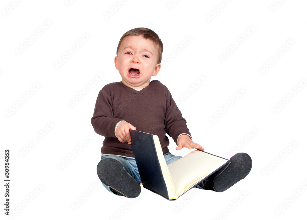 Beautiful baby with a book crying Beautiful baby with a book crying