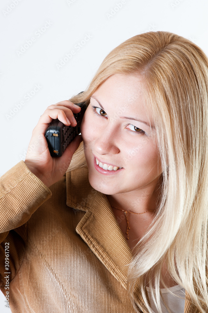 Woman talking by the phone Woman talking by the phone