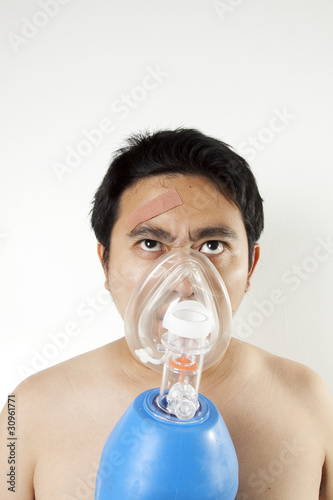 Breathing, A man using resuscitator to cure suffocating photo