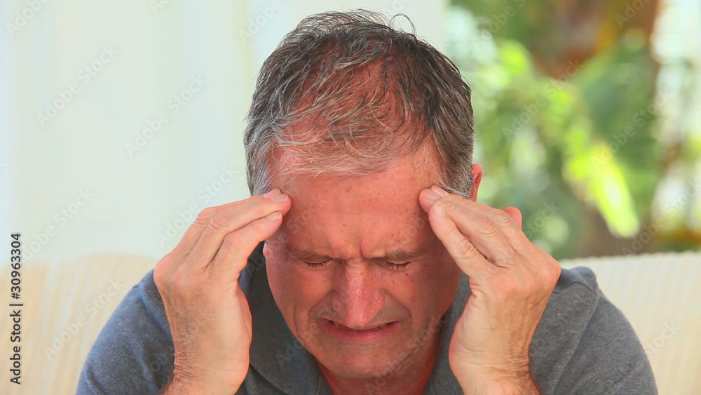 Mature man having a huge headache Mature man having a huge headache