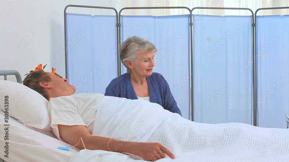 A patient having a visit of his nurse A patient having a visit of his nurse