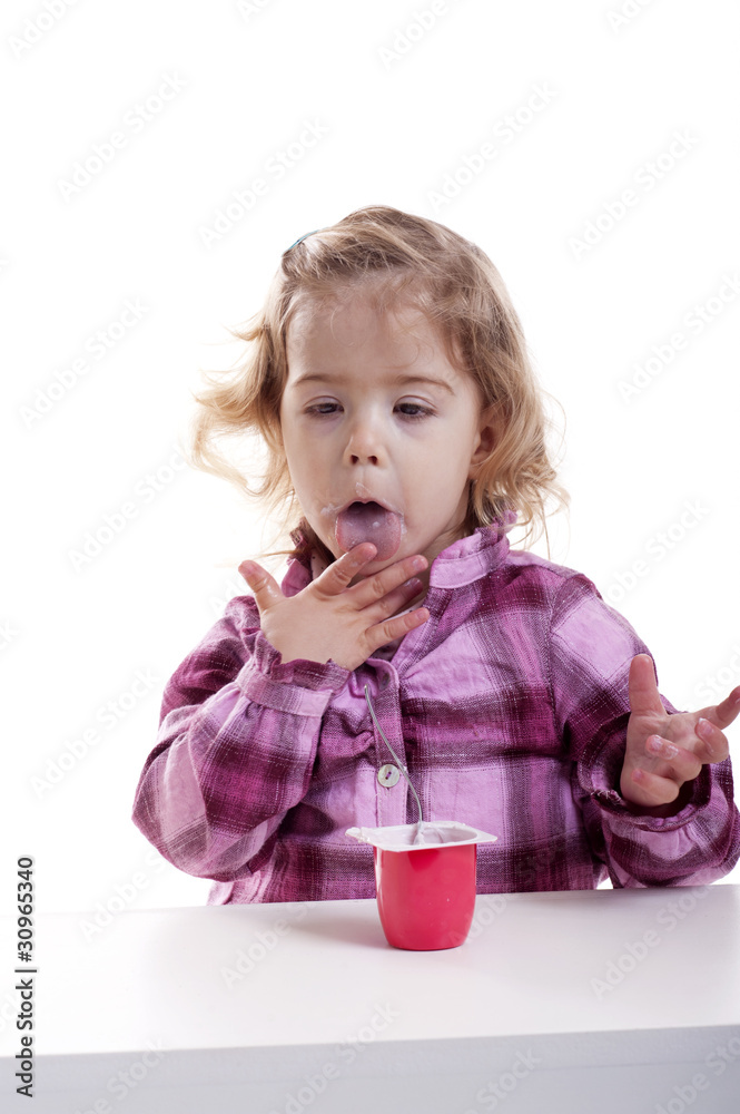 little girl licking her hands full of yogurt little girl licking her hands full of yogurt