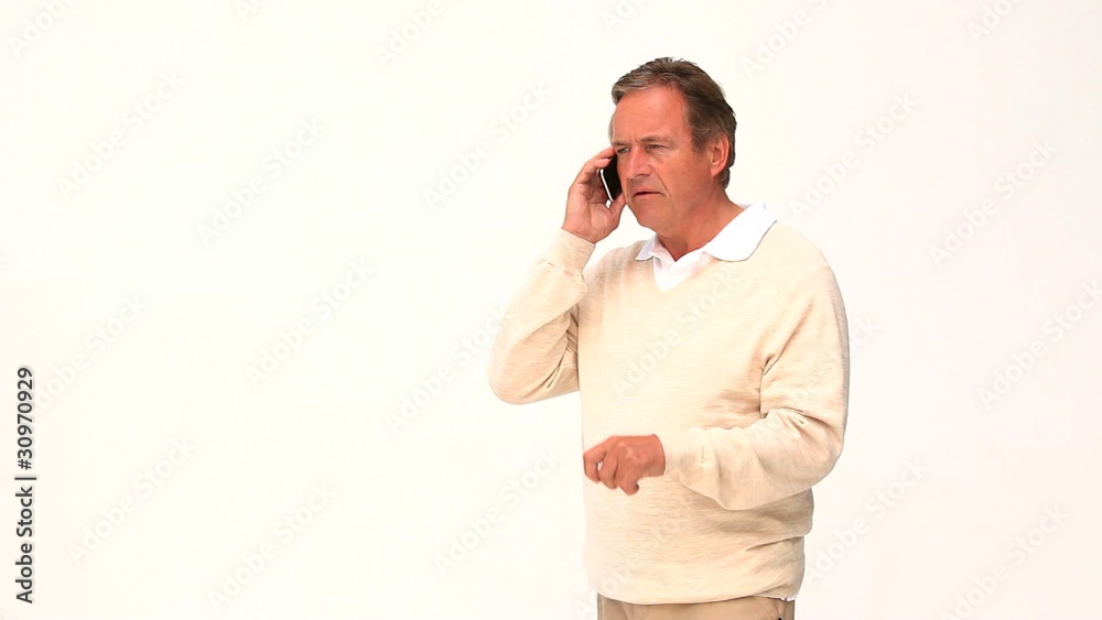 A retired man getting nervous on the phone A retired man getting nervous on the phone