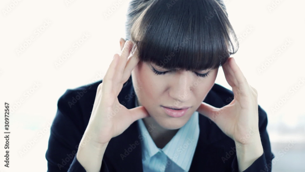 Businesswoman having headache, closeup Businesswoman having headache, closeup