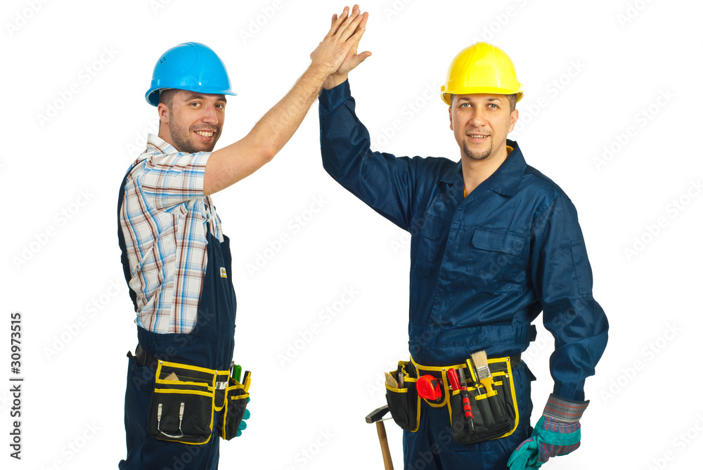 Happy constructor workers high five Happy constructor workers high five