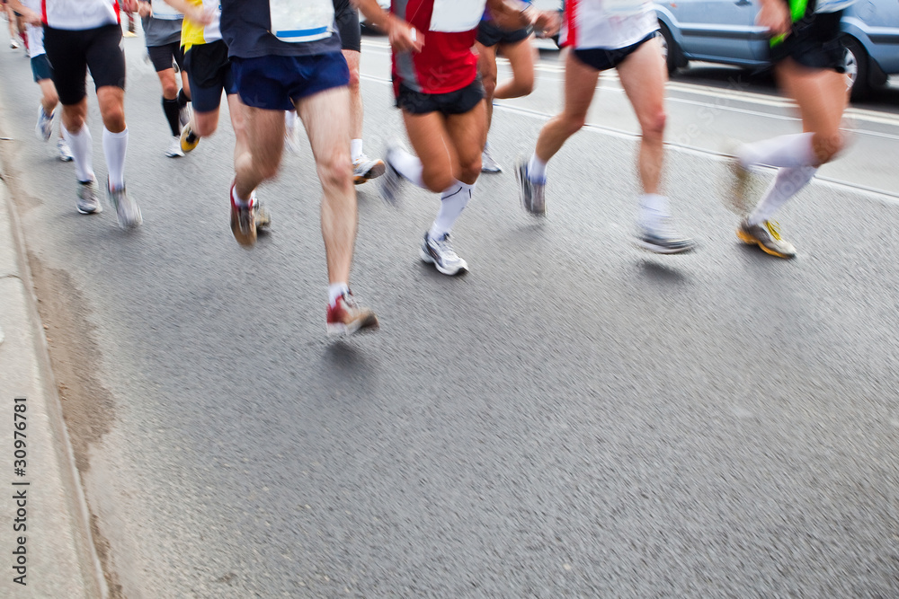 People running in city marathon