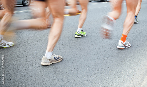 People running in city marathon