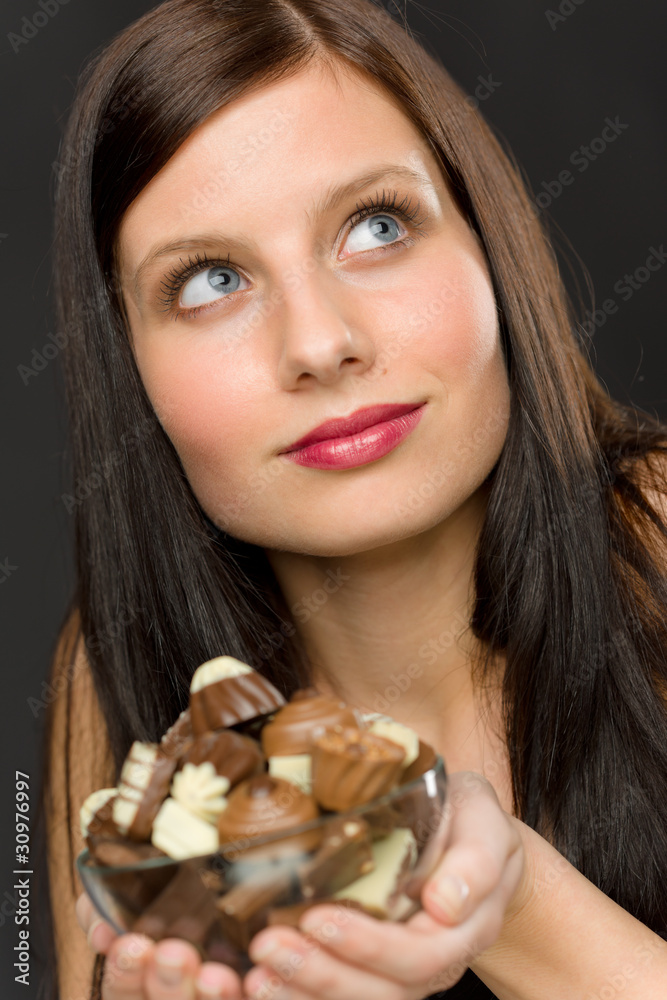 Chocolate - portrait young woman enjoy candy Chocolate - portrait young woman enjoy candy