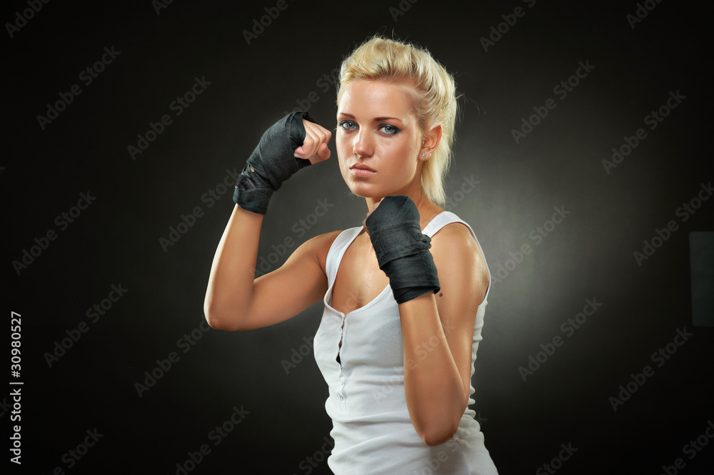 Beautiful boxer girl with black bandage on hands Beautiful boxer girl with black bandage on hands