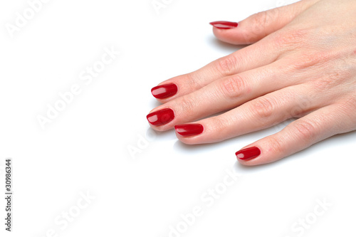 Beautiful hand with perfect nail red manicure and violet exotic