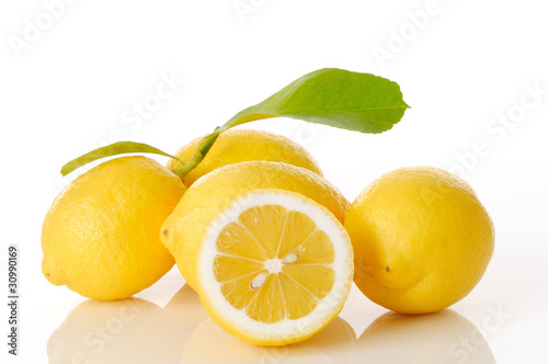 lemons and leaves on white background