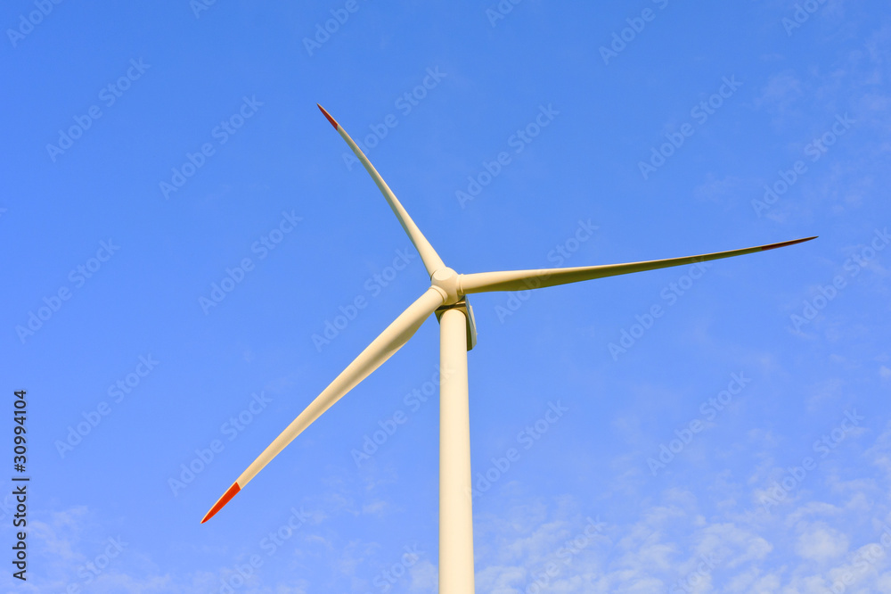 Wind turbine closeup with blue sky background Wind turbine closeup with blue sky background