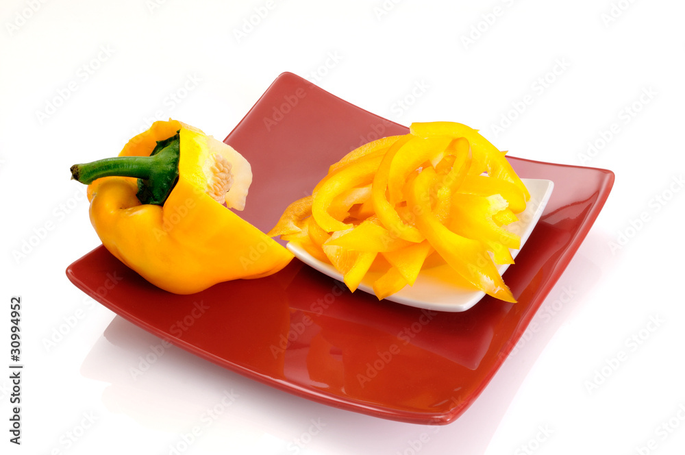 yellow pepper strips on a red dish yellow pepper strips on a red dish
