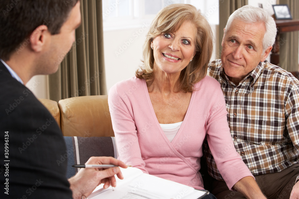 Senior Couple Talking With Financial Advisor Senior Couple Talking With Financial Advisor