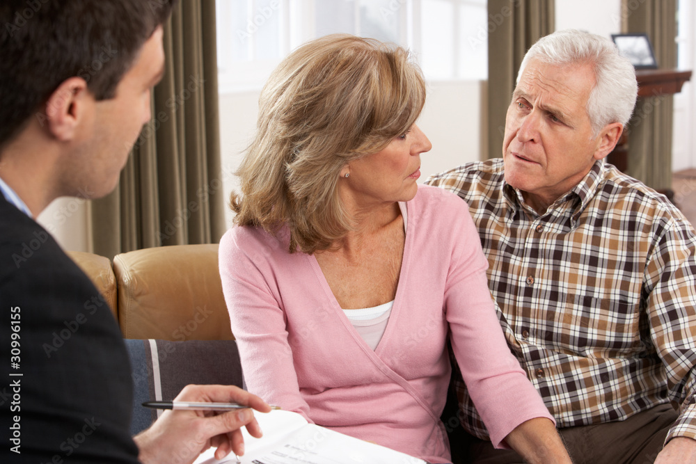 Senior Couple Talking With Financial Advisor Senior Couple Talking With Financial Advisor
