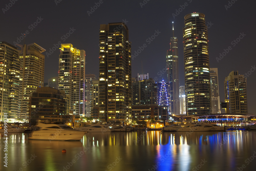 Town scape at night time. Panoramic scene, Dubai.