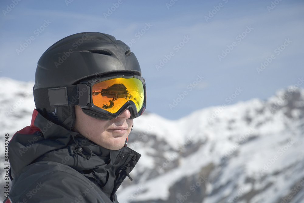 The man in the mountain-skiing form against mountains The man in the mountain-skiing form against mountains