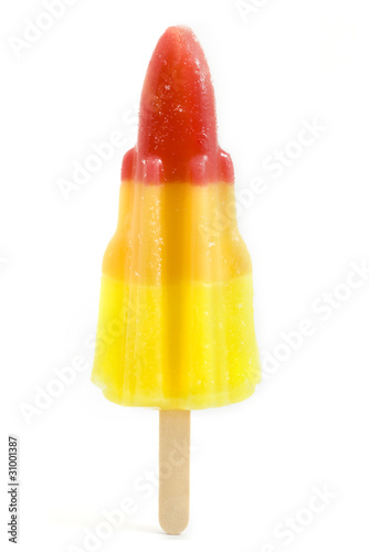 Rocket shaped ice lolly over white