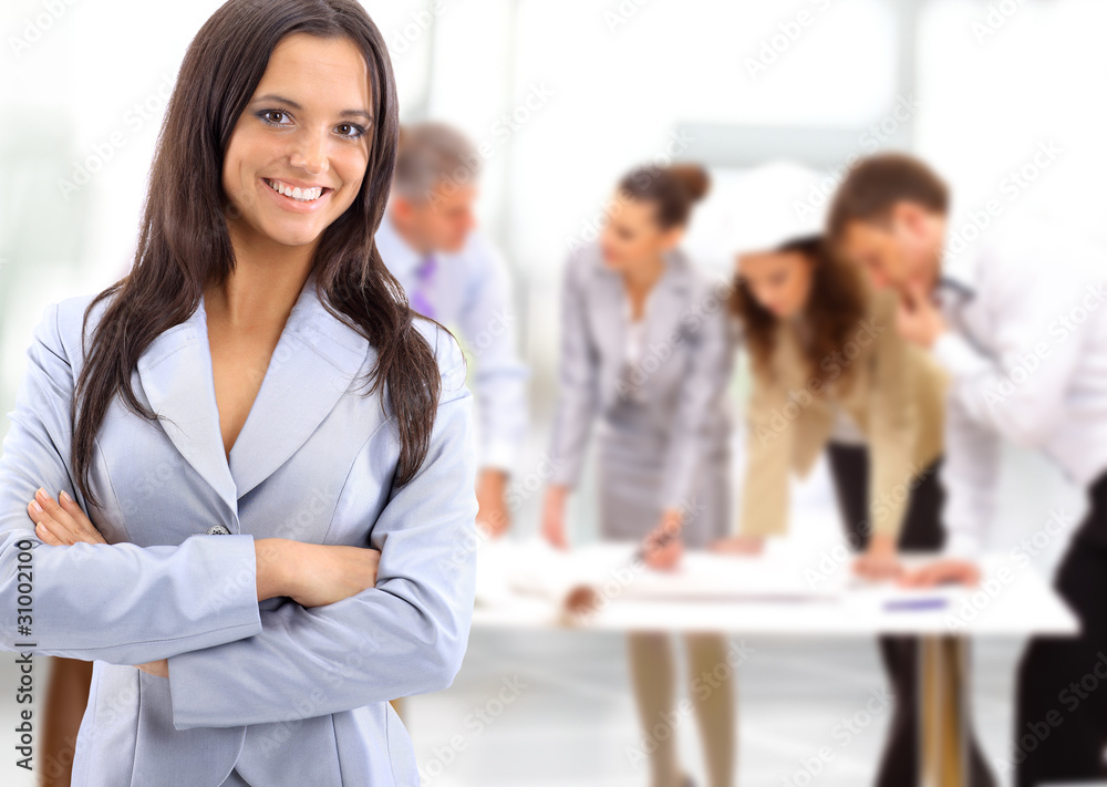 Portrait of a charismatic woman at a meeting while her Portrait of a charismatic woman at a meeting while her