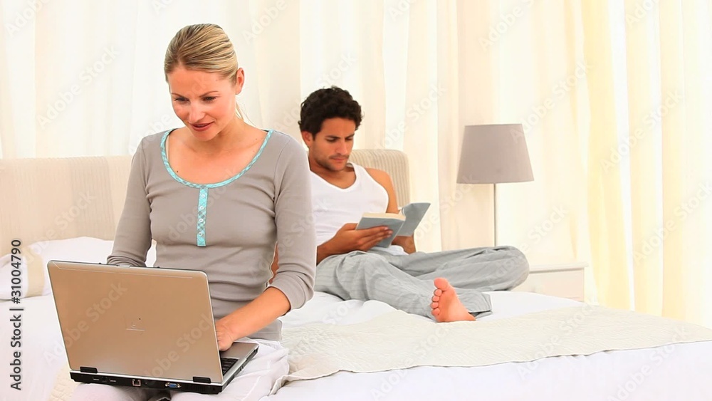 Young couple on their bed Young couple on their bed