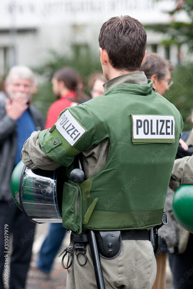Police man in uniform, watching the environment Police man in uniform, watching the environment