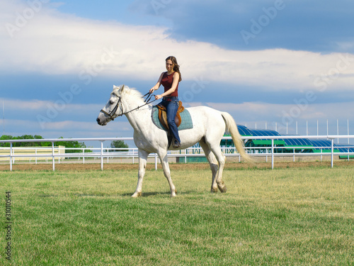 girl astride a horse