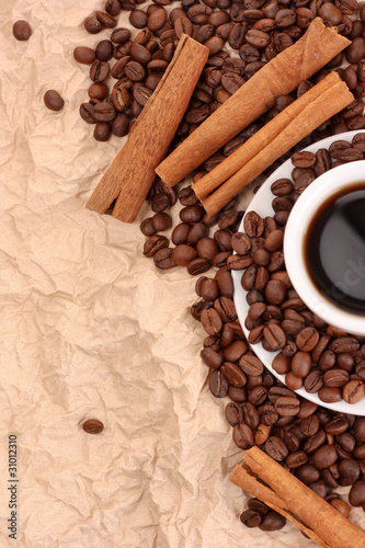 coffee with cinnamon on paper background