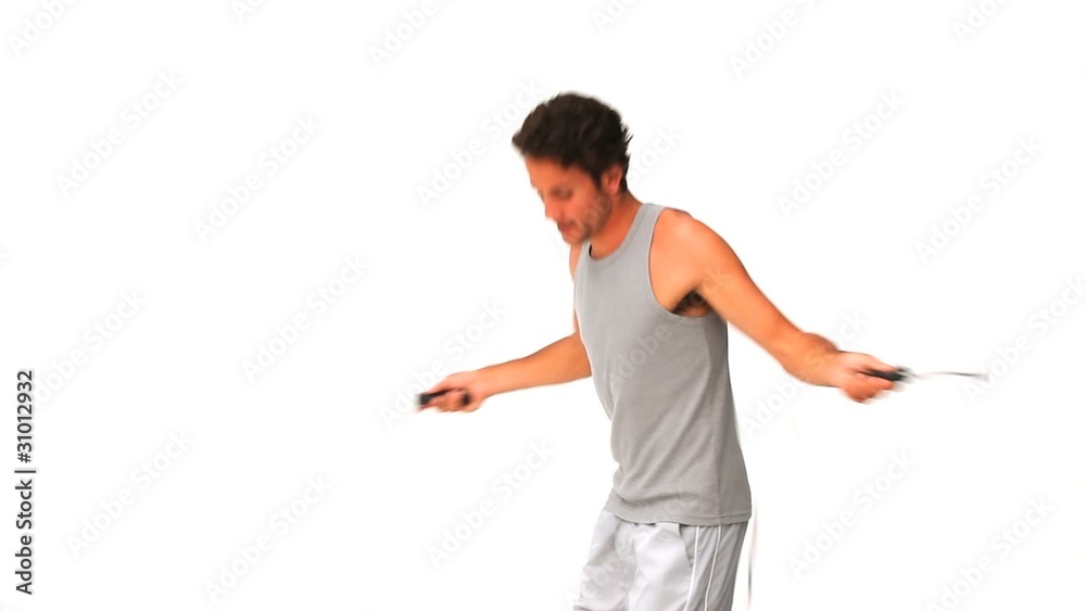 Casual man playing with a skipping rope